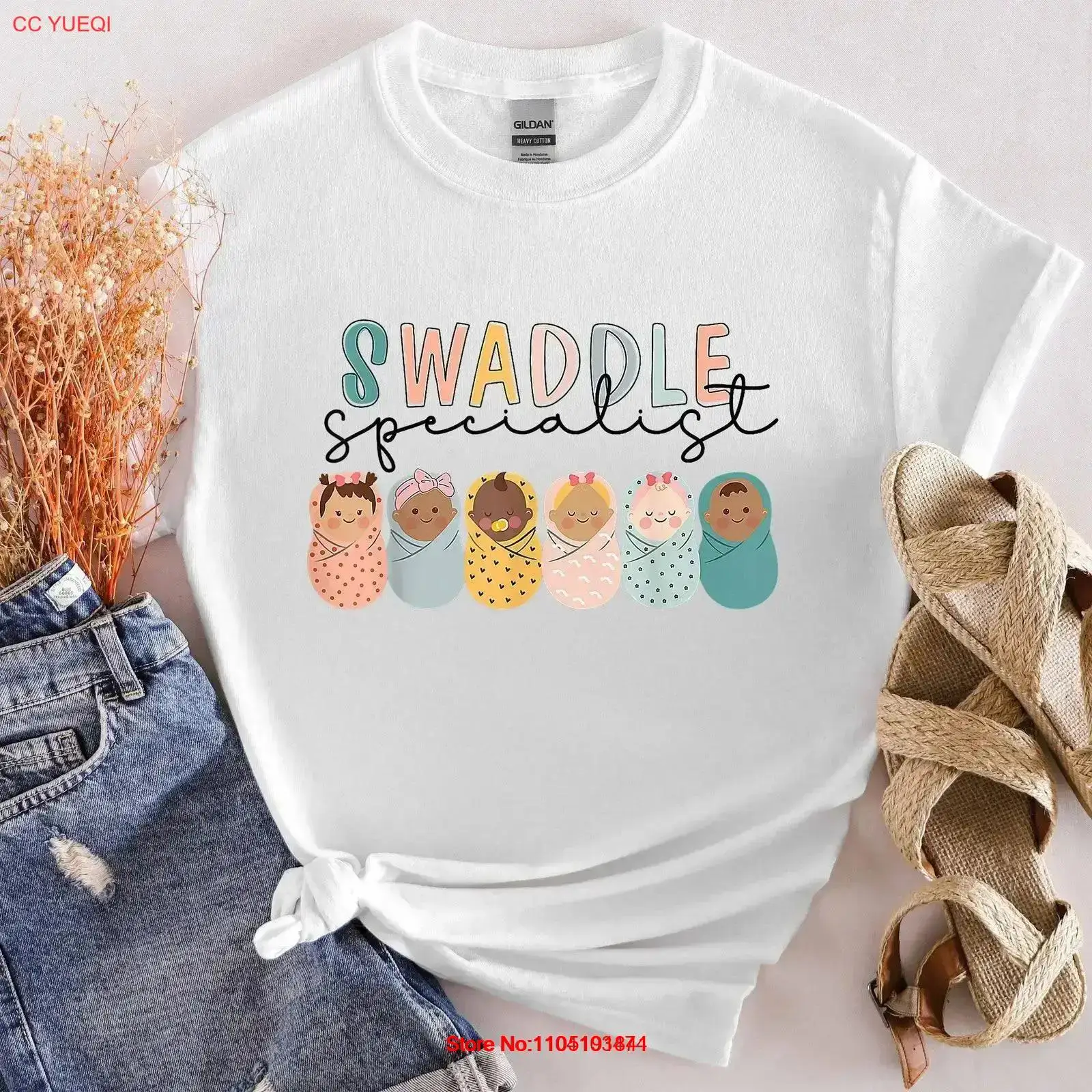 Baby Nursery Unit - เสื้อยืดพยาบาลผู้เชี่ยวชาญด้านการห่อตัวเด็กแรกเกิด สำหรับหน่วยคลอดและเด็กอ่อน (NICU) แบบคอกลม สไตล์วินเทจ ผ้าซักแล้วยืดได้